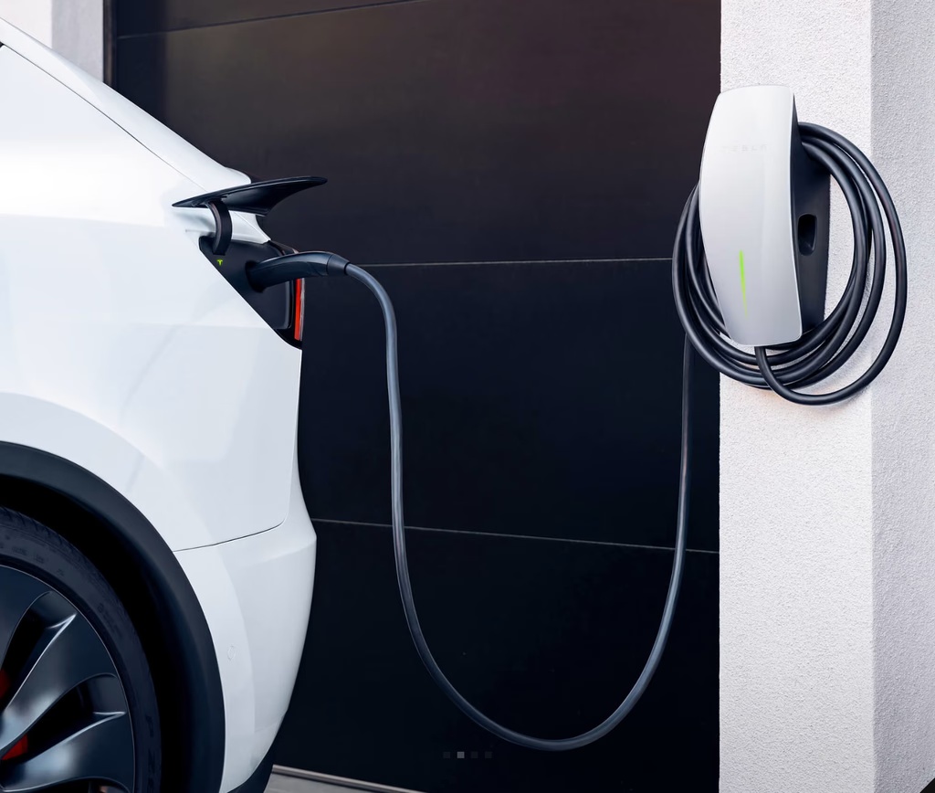 Tesla Wall Connector charging a vehicle at home